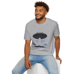 UFO t-shirt with massive mothership beaming light over city skyline at night worn by man