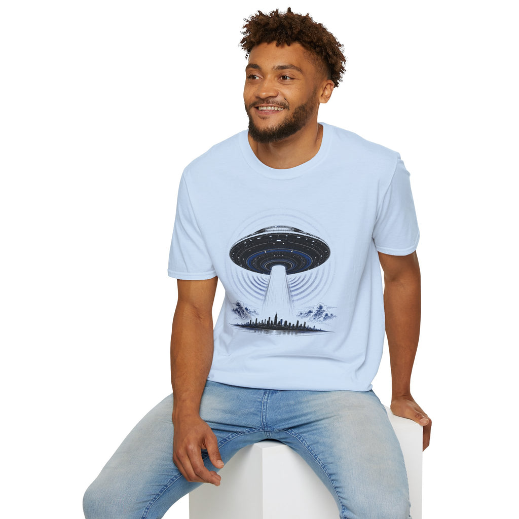 Light blue UFO t-shirt with massive mothership beaming light over city skyline at night worn by man