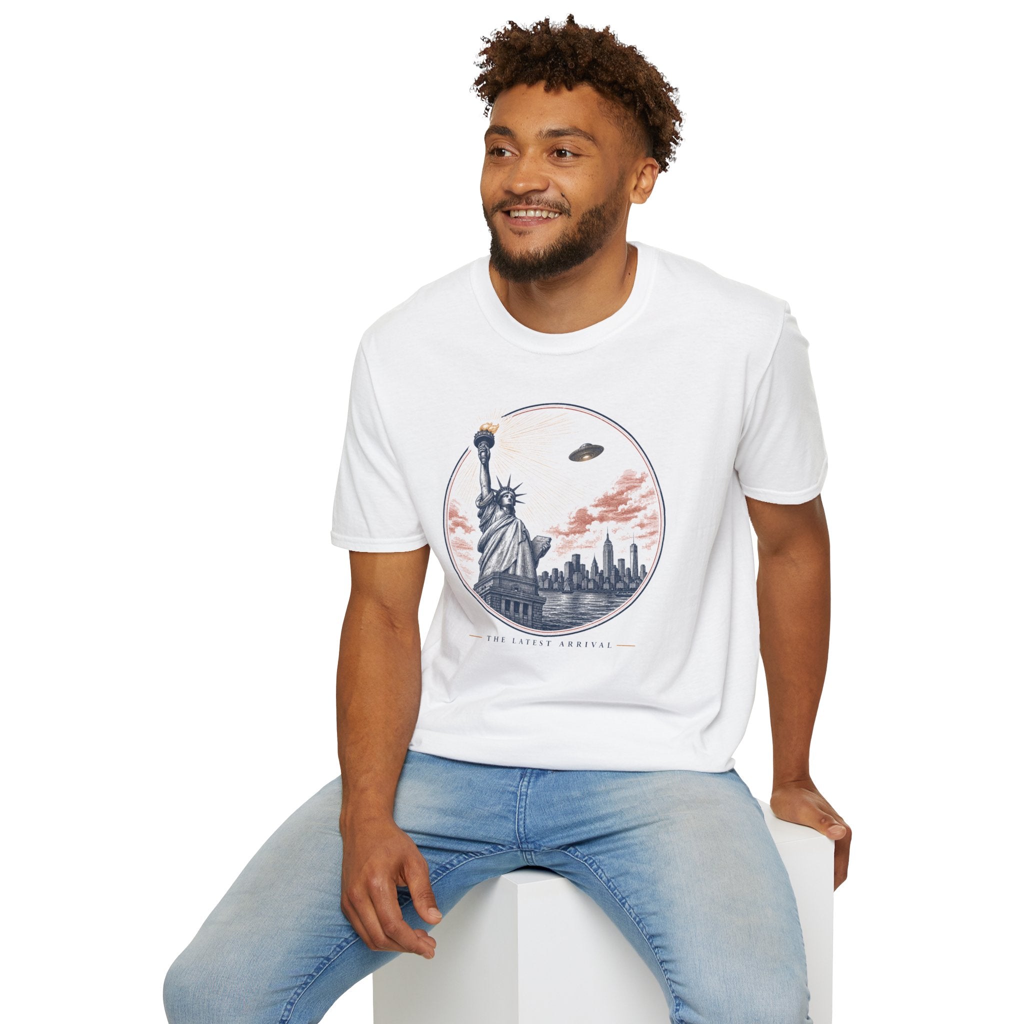 The Latest Arrival UFO t-shirt with Statue of Liberty greeting a descending saucer in engraved style, white tee