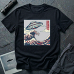 The Wave Japanese woodblock UFO t-shirt — flying saucer above Hokusai-style cresting wave in indigo and red on black cotton tee