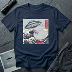The Wave Japanese woodblock UFO t-shirt — flying saucer above Hokusai-style cresting wave in indigo and red on navy blue cotton tee