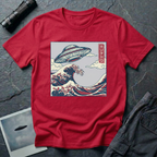 The Wave Japanese woodblock UFO t-shirt — flying saucer above Hokusai-style cresting wave in indigo and red on red cotton tee
