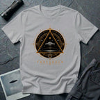 Grey UFO t-shirt with a flying saucer inside an upward-pointing triangle portal with perspective grid, crescent moons, and compass frame in gold and black with the word THRESHOLD
