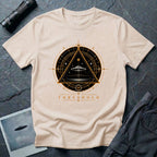 Natural UFO t-shirt with a flying saucer inside an upward-pointing triangle portal with perspective grid, crescent moons, and compass frame in gold and black with the word THRESHOLD