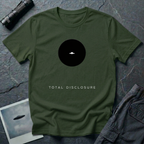 Total Disclosure conceptual UFO t-shirt — small black circle with tiny saucer and "total disclosure" caption on military green cotton tee