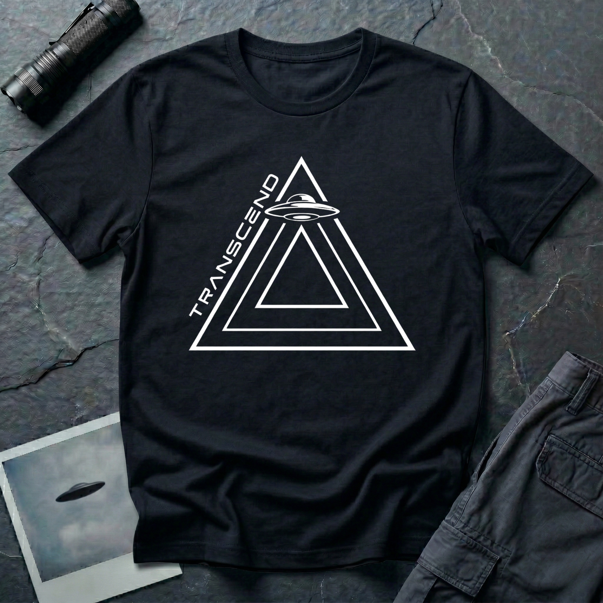 Transcend minimalist UAP t-shirt — nested line triangles with flying saucer on black unisex cotton tee