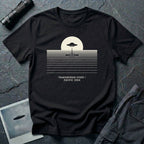 T-shirt with UFO above rippling ocean horizon lines and Transmedium Event Pacific 2004 caption, black