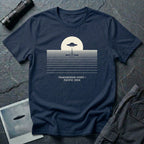 T-shirt with UFO above rippling ocean horizon lines and Transmedium Event Pacific 2004 caption, navy blue