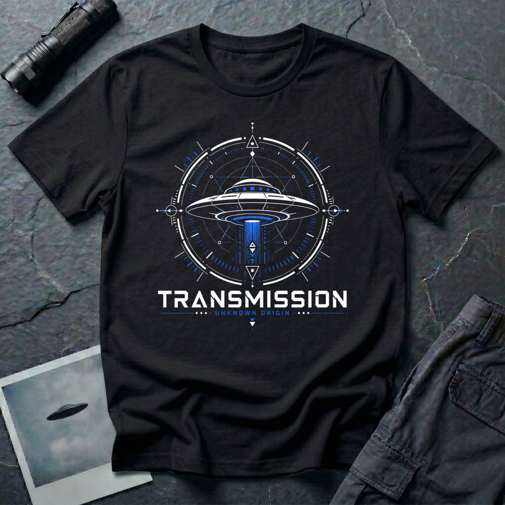 Black UFO t-shirt with a flying saucer inside a sacred geometry compass and the words "TRANSMISSION · UNKNOWN ORIGIN ·" in white and blue