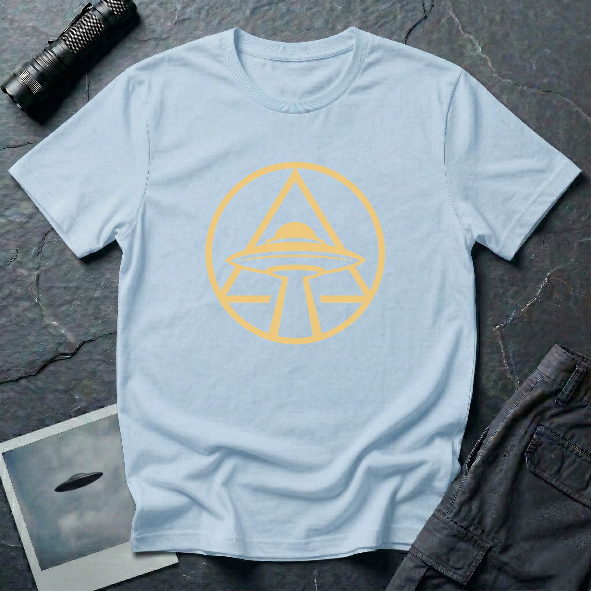 UFO apex t-shirt with gold geometric emblem of a saucer beaming light inside a triangle and circle, light blue