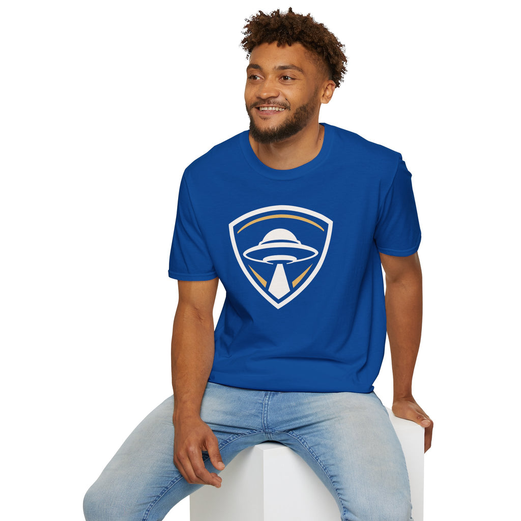 Man wearing royal blue UFO insignia t-shirt with gold and cream crest emblem and classic saucer beaming light