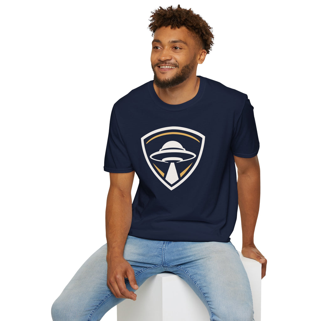 Man wearing navy blue UFO insignia t-shirt with gold and cream crest emblem and classic saucer beaming light