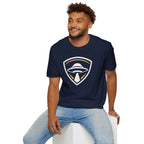 Man wearing navy blue UFO insignia t-shirt with gold and cream crest emblem and classic saucer beaming light