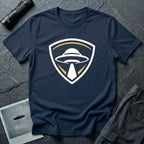 UFO insignia navy blue t-shirt with gold and cream crest emblem and classic saucer beaming light