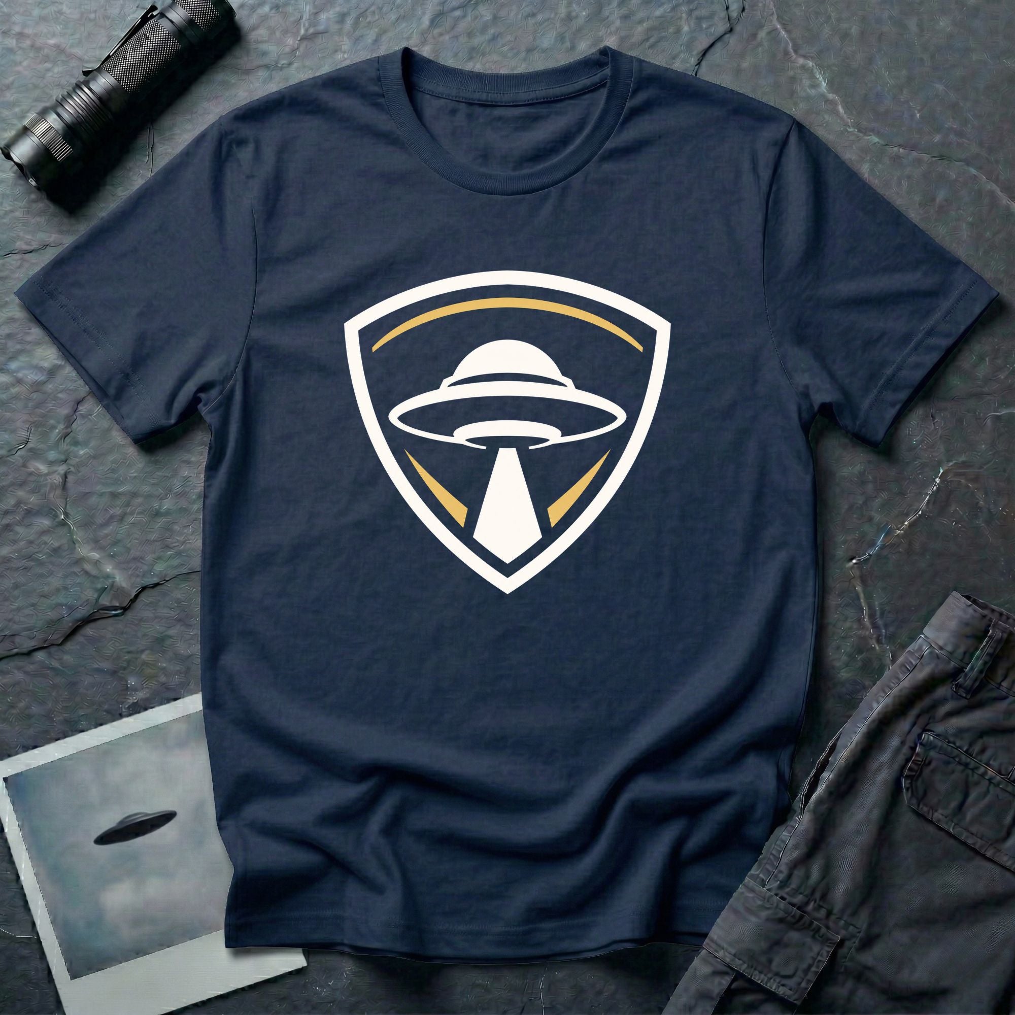 UFO insignia navy blue t-shirt with gold and cream crest emblem and classic saucer beaming light