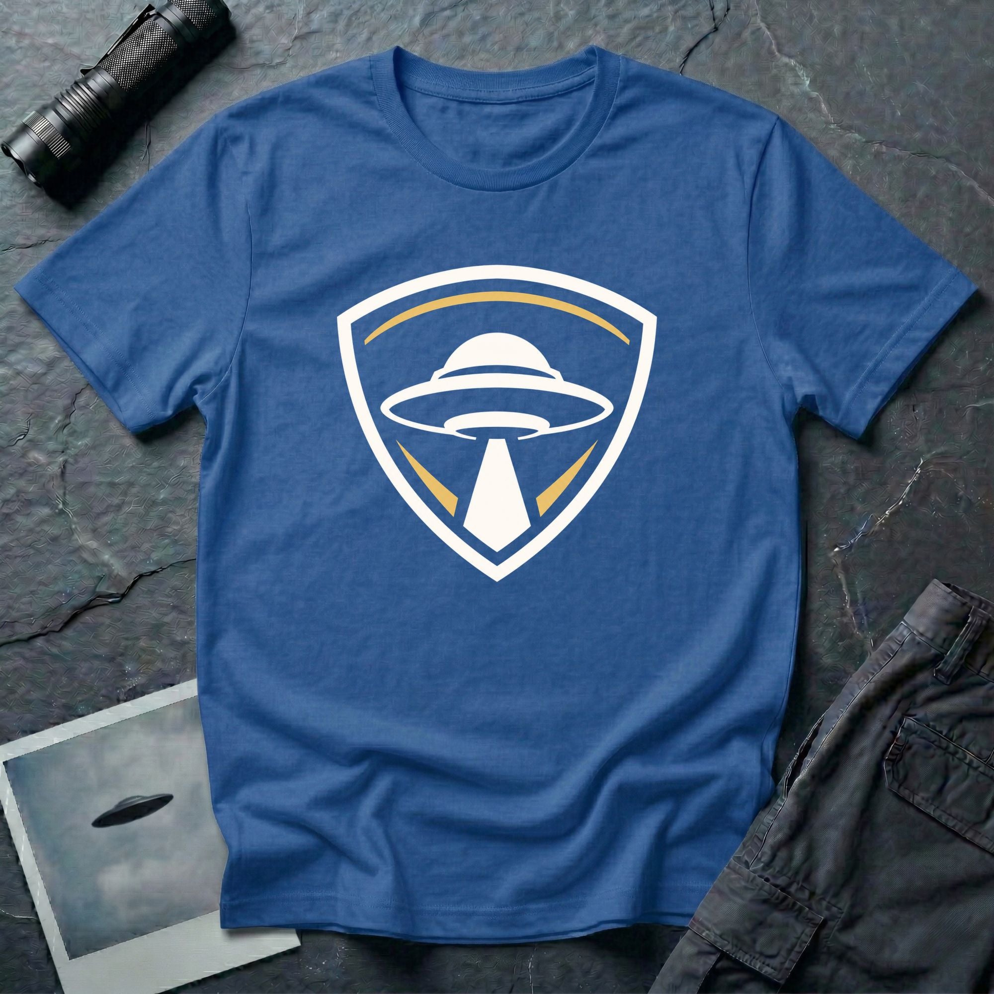 UFO insignia royal blue t-shirt with gold and cream crest emblem and classic saucer beaming light