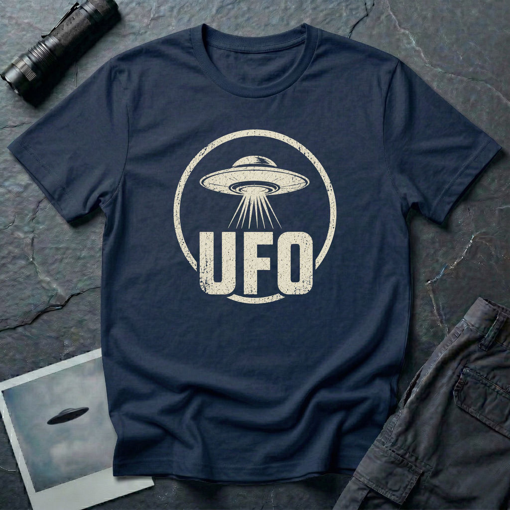 Navy blue retro UFO t-shirt with a distressed circle containing a flying saucer with tractor beam and bold block letters spelling UFO in white