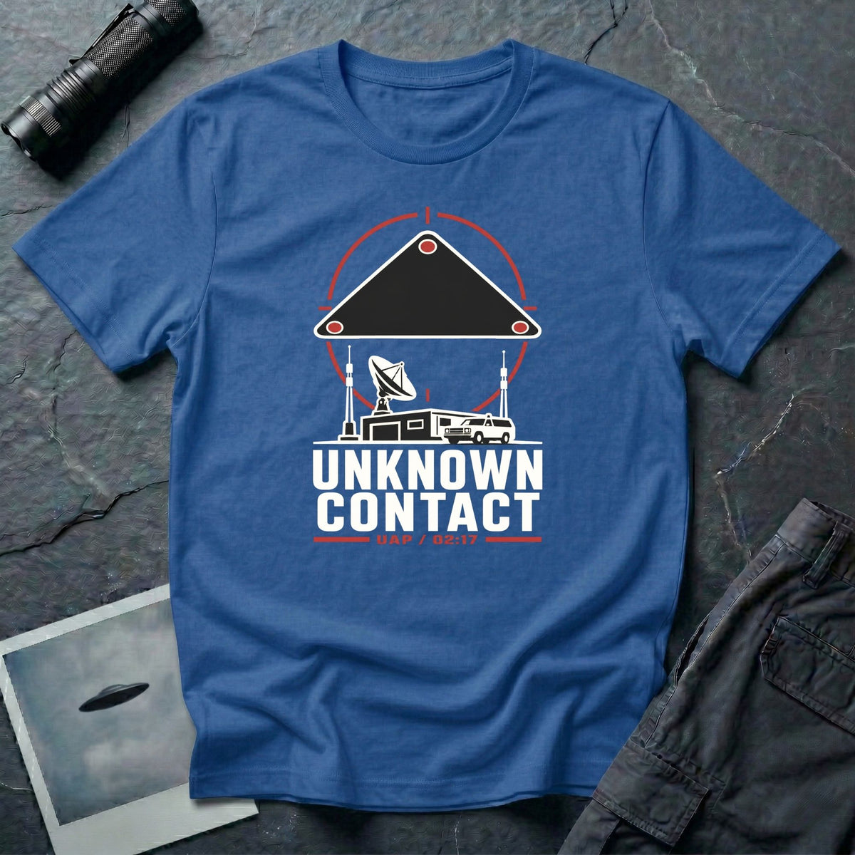 Radar station with satellite dish and vehicle beneath a targeted triangular UAP contact reticle with Unknown Contact UAP 02:17 text on a royal blue t-shirt