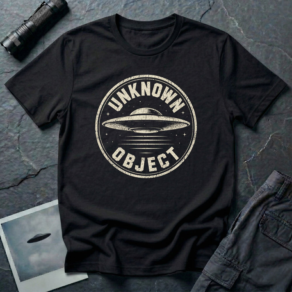 Black retro UFO t-shirt with a distressed circular badge showing a flying saucer with speed lines and the words UNKNOWN OBJECT in white
