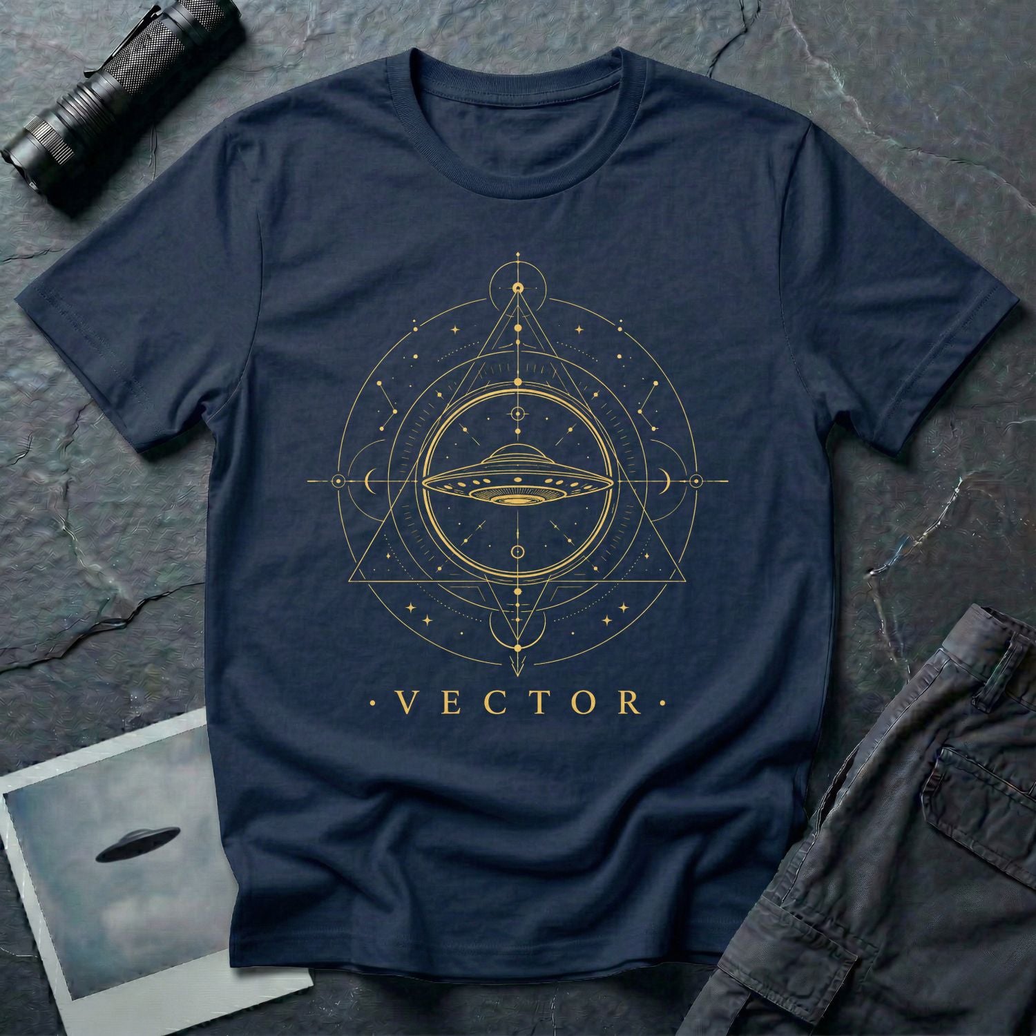 Navy blue UFO t-shirt with a flying saucer inside an upward-pointing sacred geometry triangle with compass points and crescent moons in gold with the word VECTOR beneath