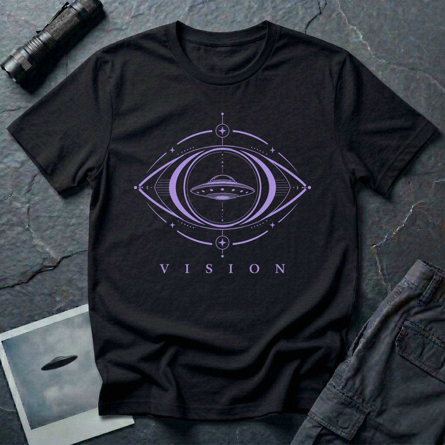 Black UFO t-shirt with a flying saucer inside a third eye sacred geometry frame in lavender purple with the word VISION beneath