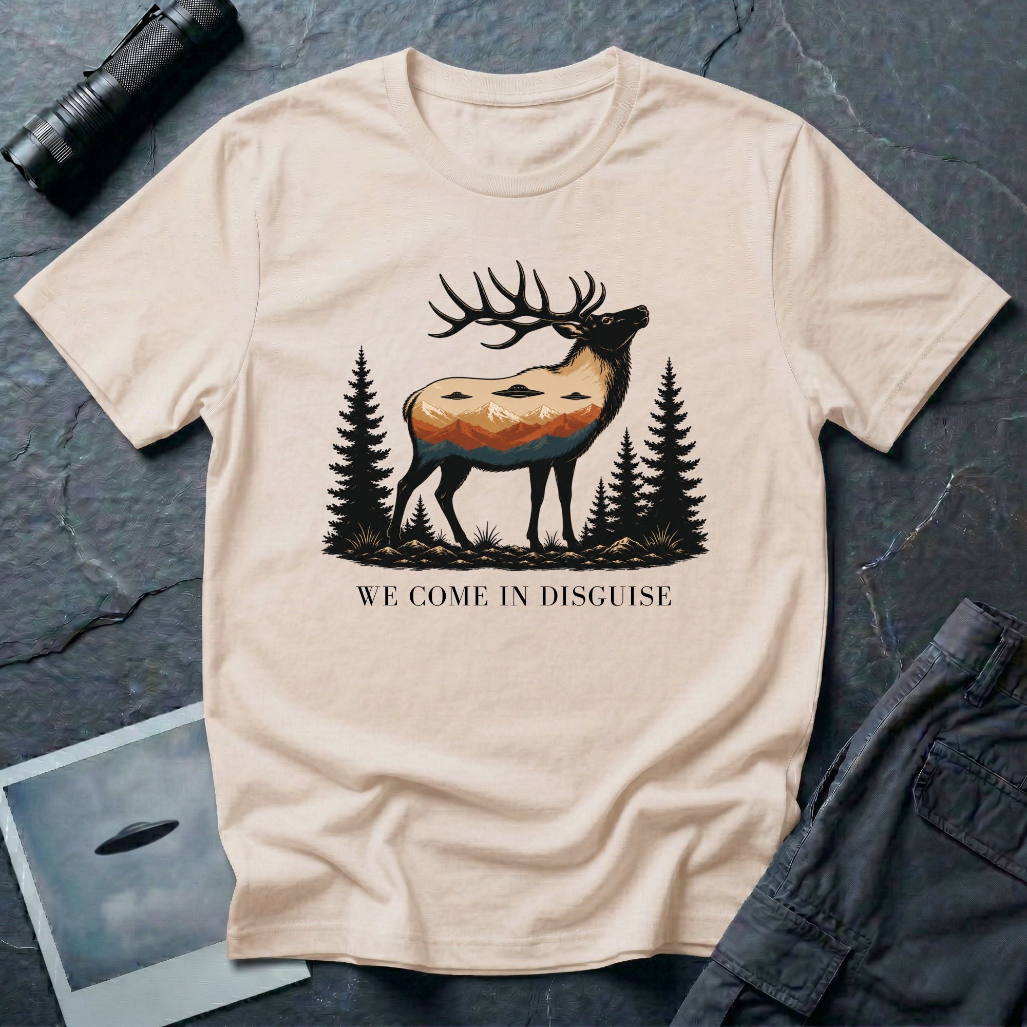 We Come in Disguise UFO t-shirt with deer double exposure hiding three saucers in mountain skyline, natural