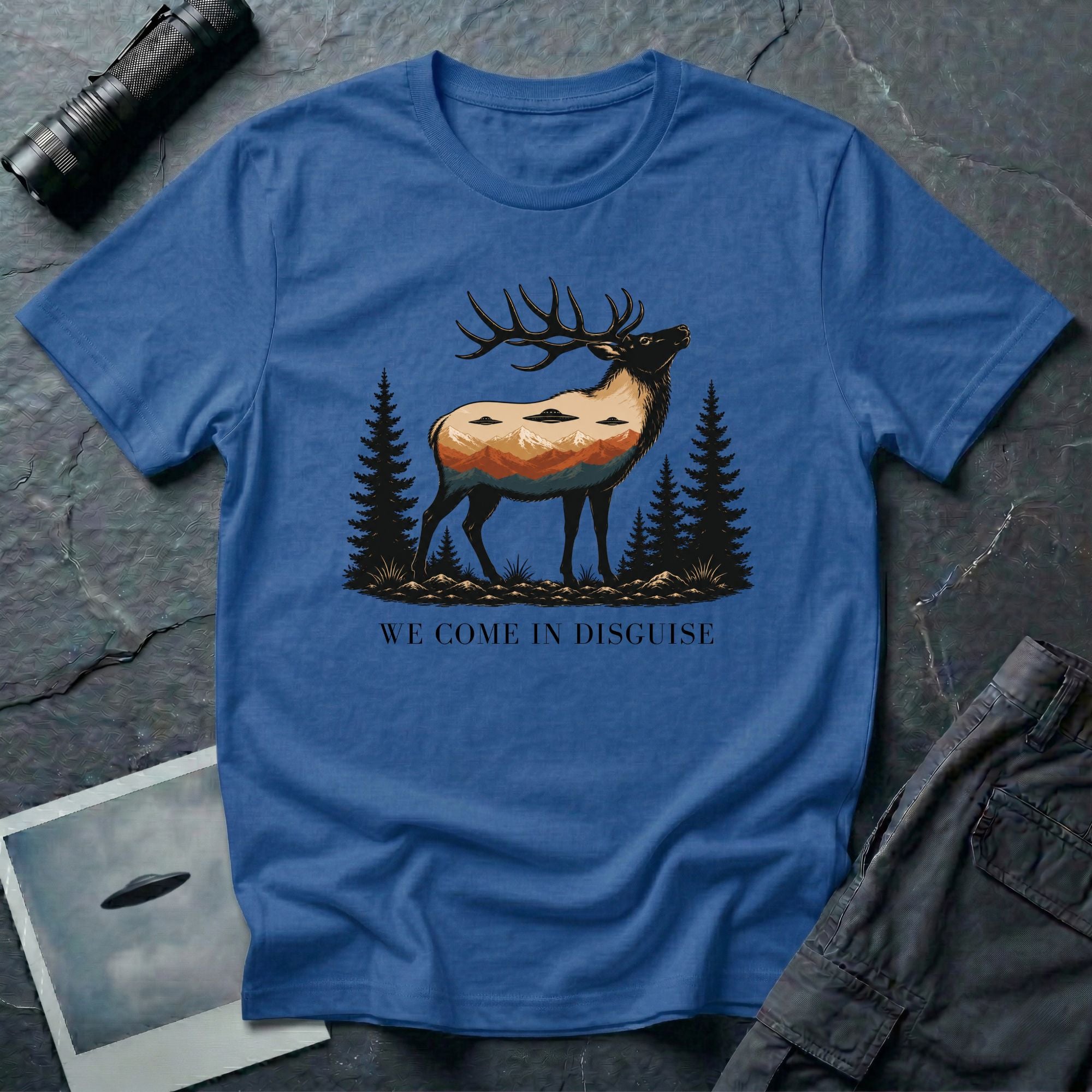 We Come in Disguise UFO t-shirt with deer double exposure hiding three saucers in mountain skyline, blue
