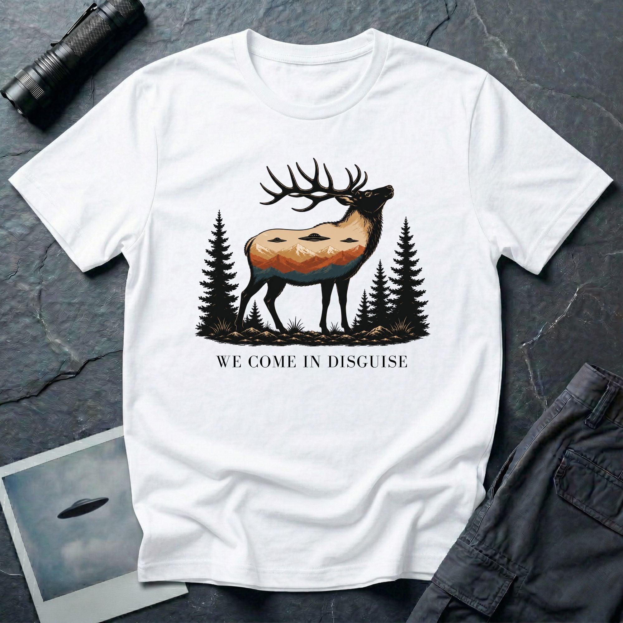 We Come in Disguise UFO t-shirt with deer double exposure hiding three saucers in mountain skyline, white