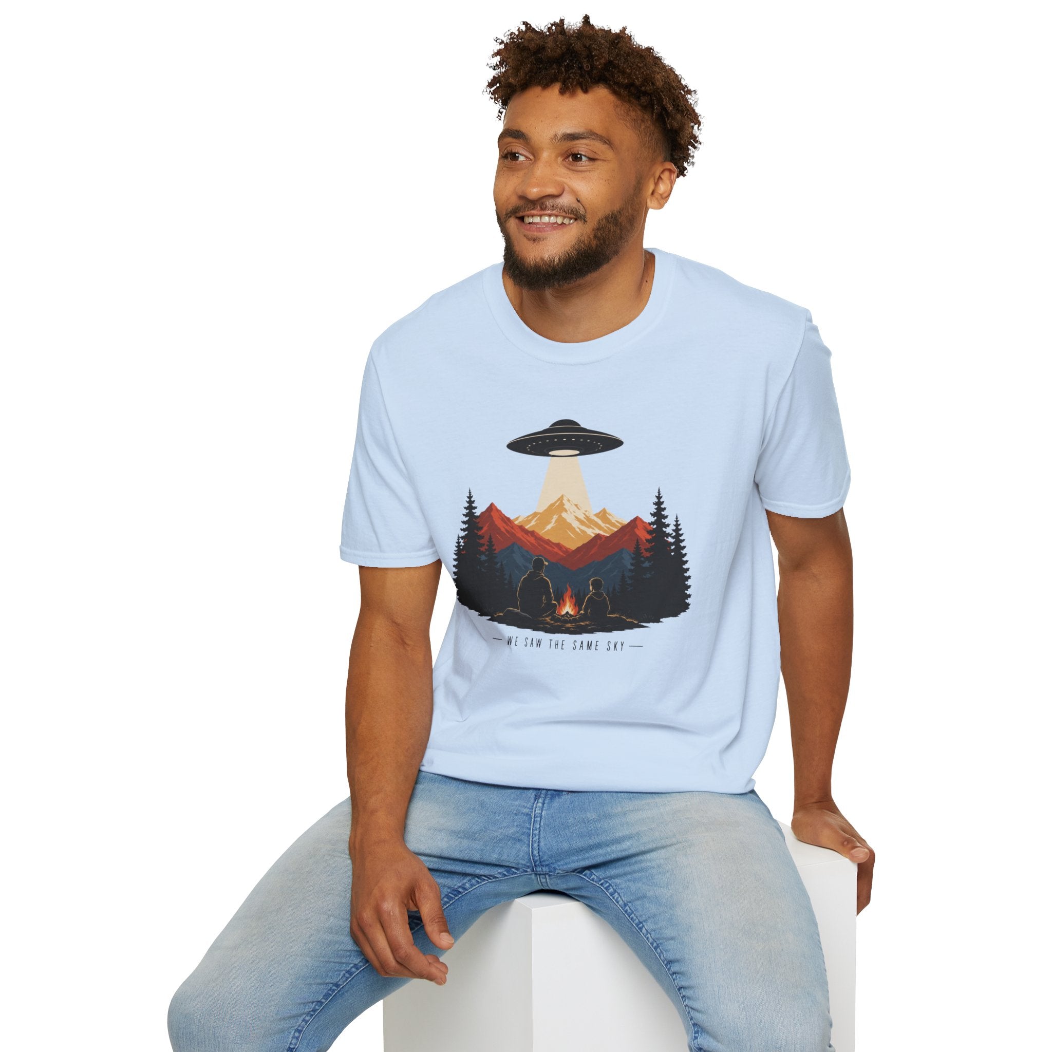 We Saw the Same Sky UFO t-shirt with father and child at campfire watching saucer over mountains, light blue