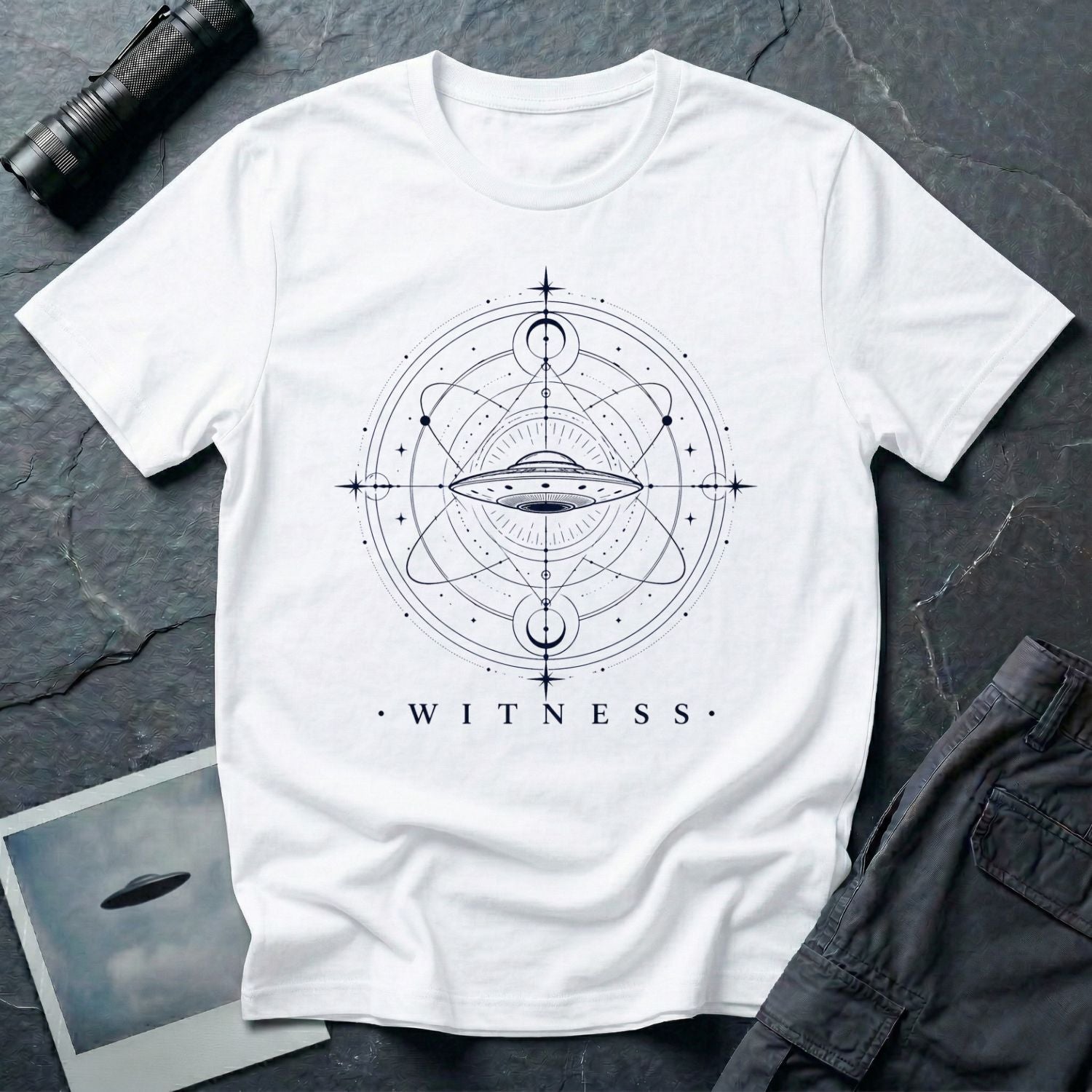 White UFO t-shirt with a flying saucer at the centre of orbital rings and sacred geometry in black with the word WITNESS beneath